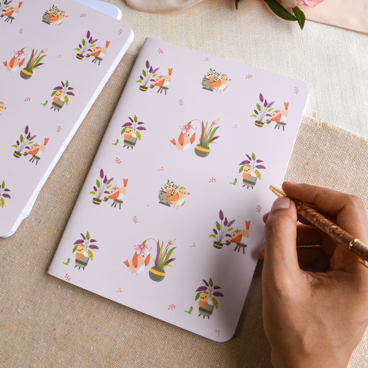 Writing notes in elegant pink A5 ruled notebook