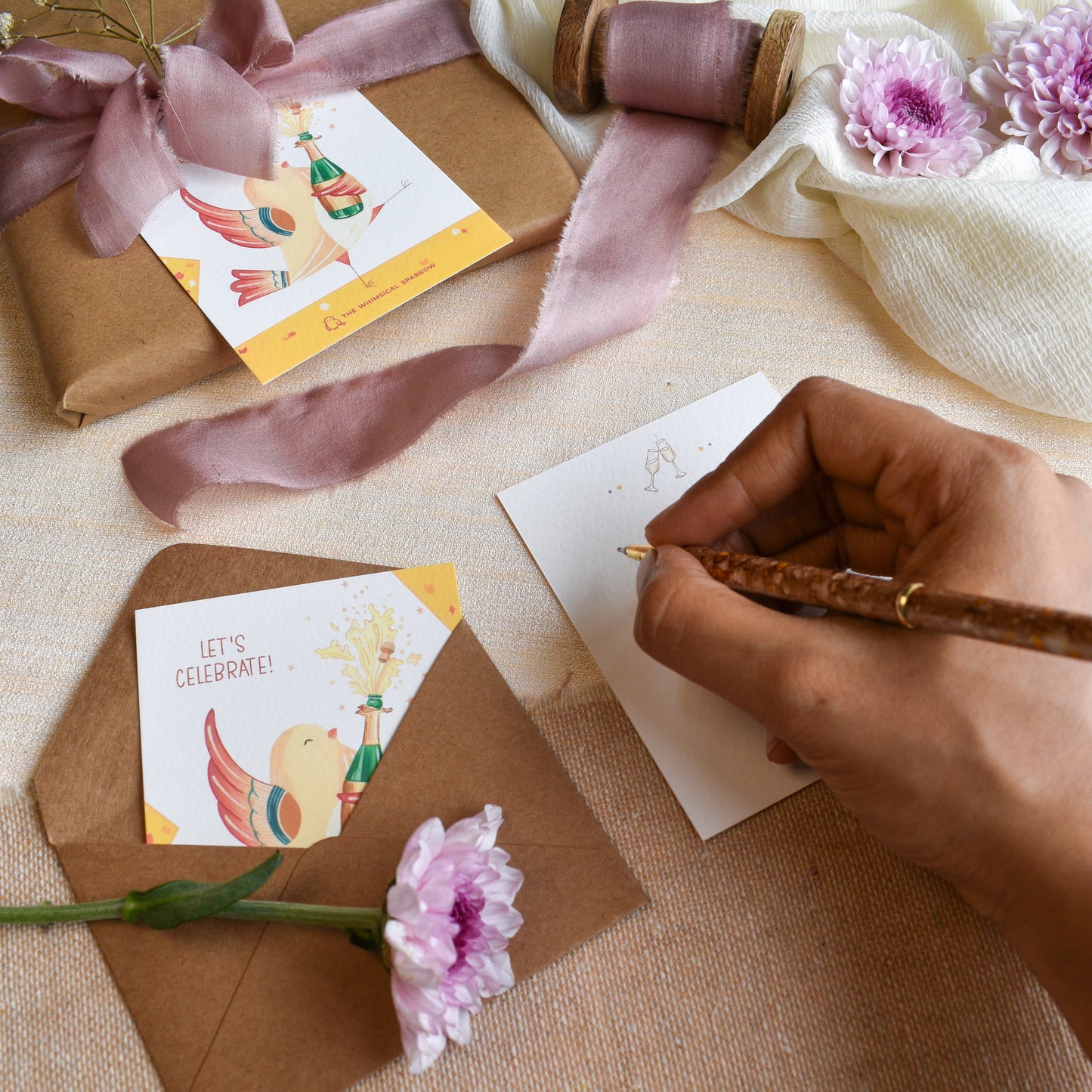 Writing message on celebration hand painted note cards for gifting