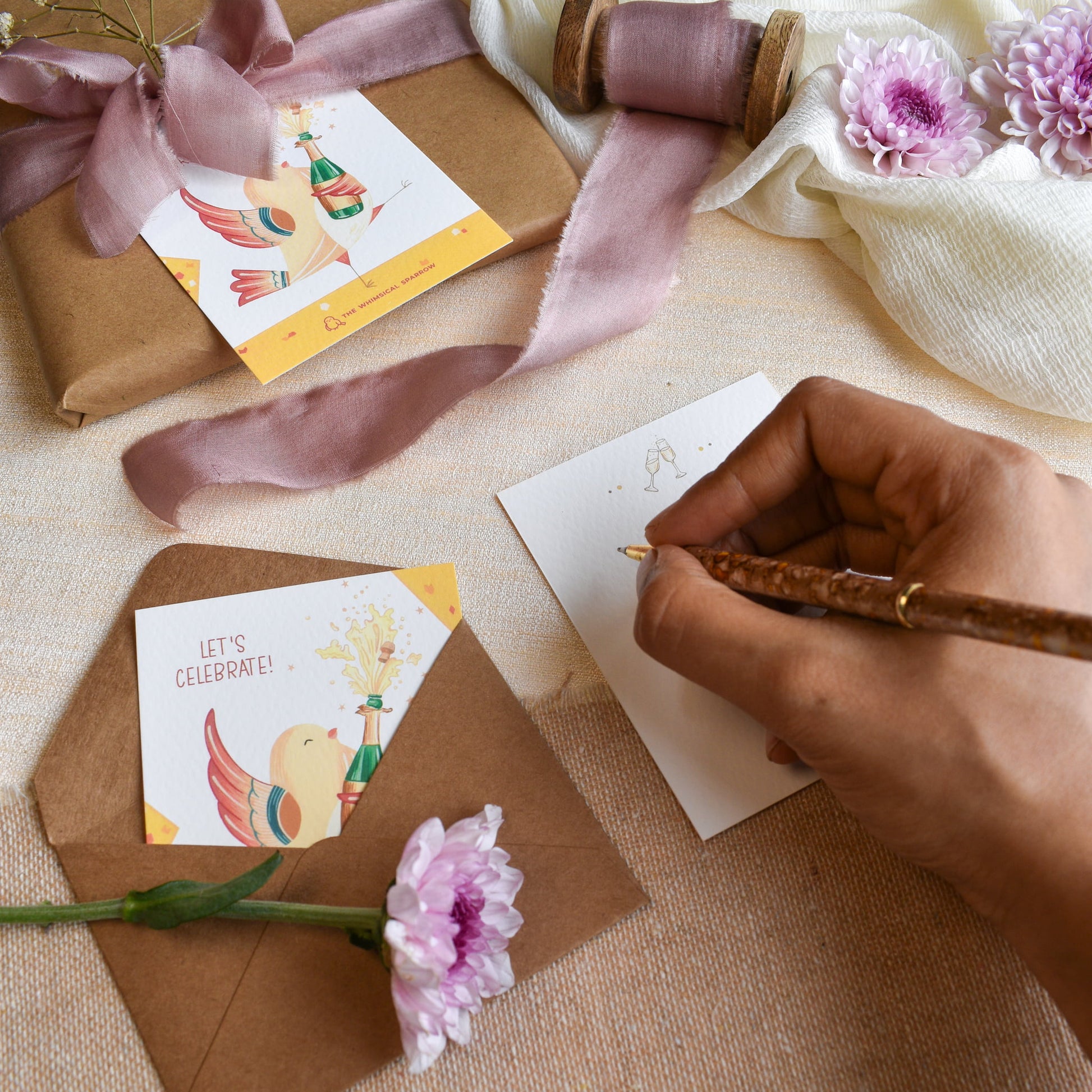 Writing message on celebration hand painted note cards for gifting