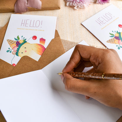 Writng message inside hello sparrow greeting card