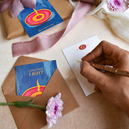 Writing message on diwali hand painted note cards for gifting